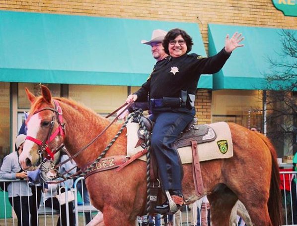 Lupe Valdez, seen here at a Mardi Gras parade in Dallas in February 2017, is used to overcoming long odds and breaking barriers.