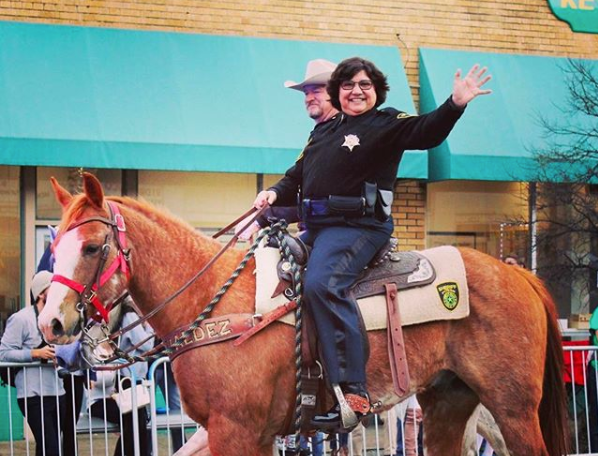 Lupe Valdez, seen here at a Mardi Gras parade in Dallas in February 2017, is used to overcoming long odds and breaking barriers.