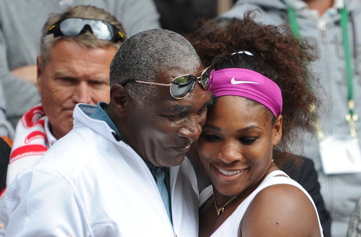Serena Williams hugs her father, Richard Williams, after winning her Ladies Singles Final match at the 2012 Wimbledon Te