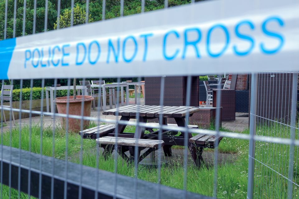 The Mill pub's beer garden has been left untouched since early March. Weeds crawl over abandoned furniture.