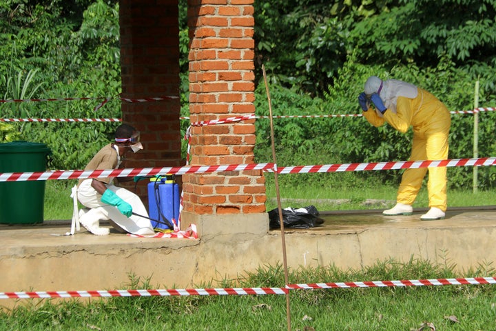 A health worker is sprayed with chlorine after visiting the isolation ward at Bikoro hospital, which received a new suspected Ebola case, in Bikoro, Democratic Republic of Congo.