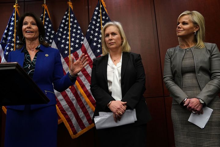 Sen. Kirsten Gillibrand (D-NY) (C) and former Fox News commentator Gretchen Carlson (R) listen as Rep. Cheri Bustos (D-IL) speaks during a news conference December 6, 2017 on Capitol Hill in Washington, DC. 