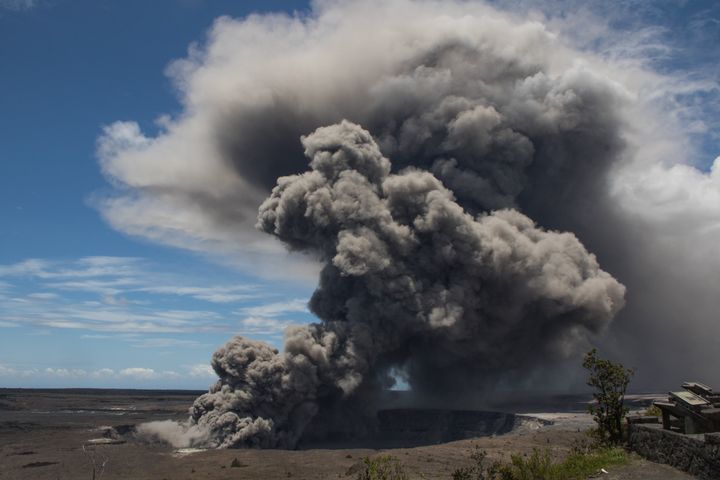 The ash plume billows upward from Kilauea.