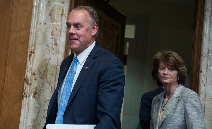 Interior Secretary Ryan Zinke and Sen. Lisa Murkowski (R-Alaska) arrive for a Senate hearing in May.