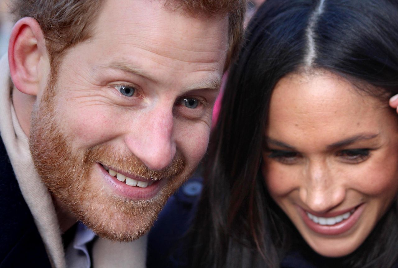 The Prince and his bride-to-be at their first official engagement together at a Terrence Higgins Trust World AIDS Day charity fair 