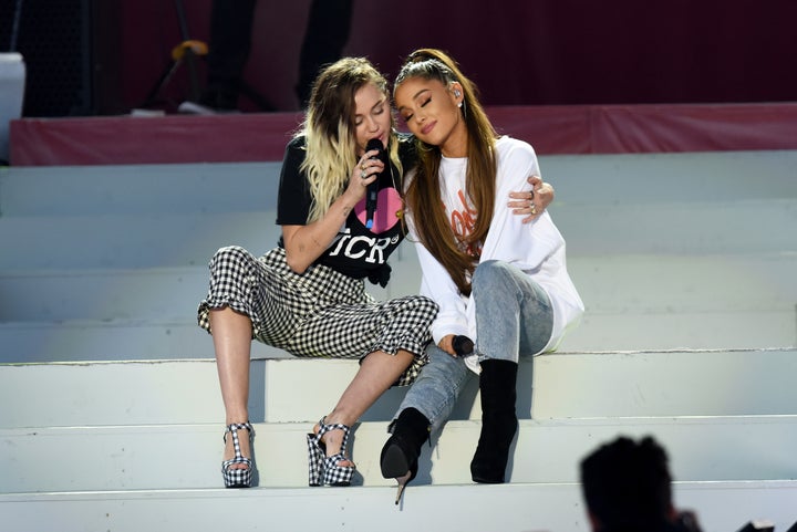 Miley Cyrus and Ariana Grande perform on stage during 'One Love Manchester' benefit concert.