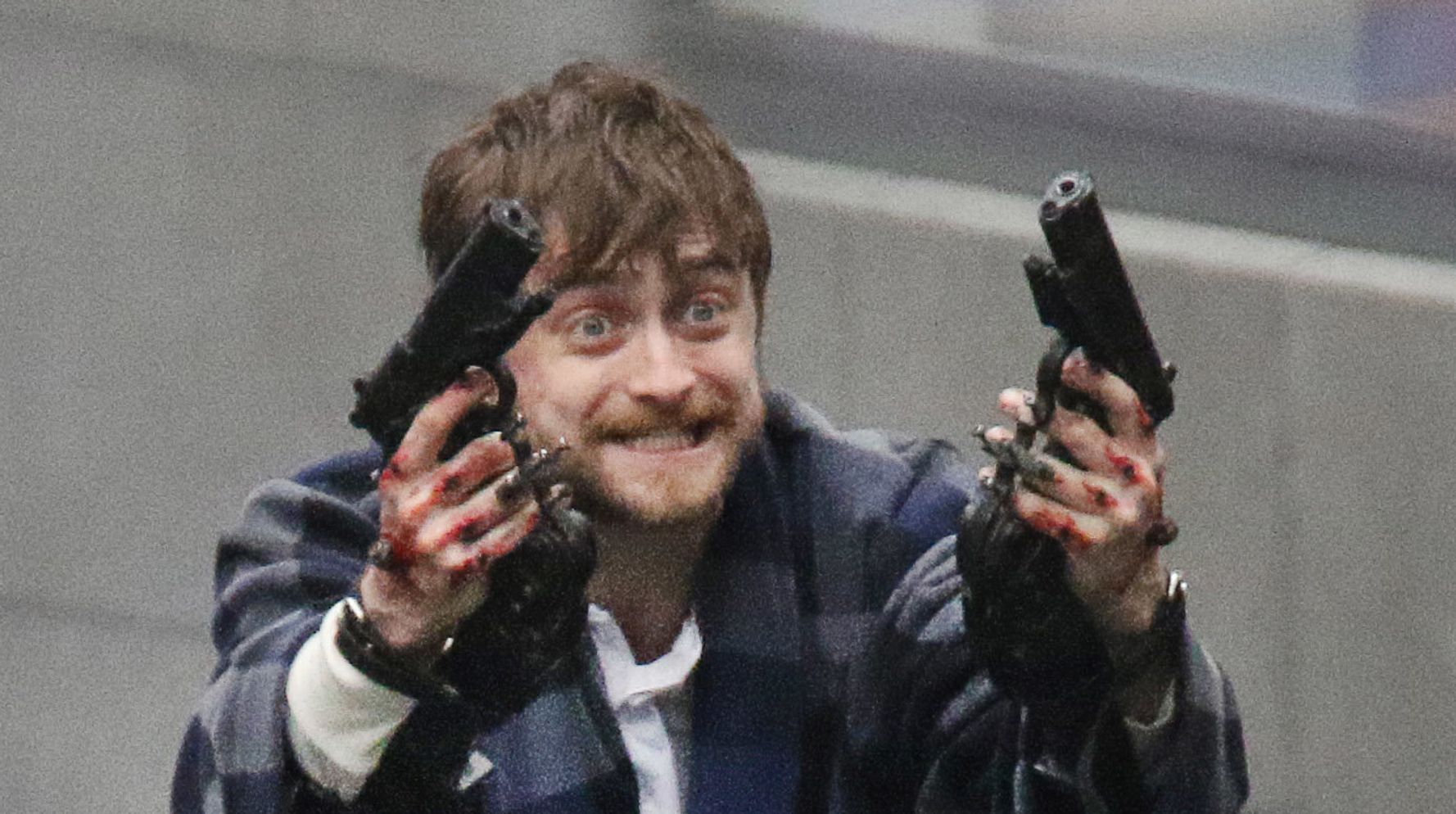 Photo Of Daniel Radcliffe Holding Guns In Crazy Slippers Becomes A Magical Meme...