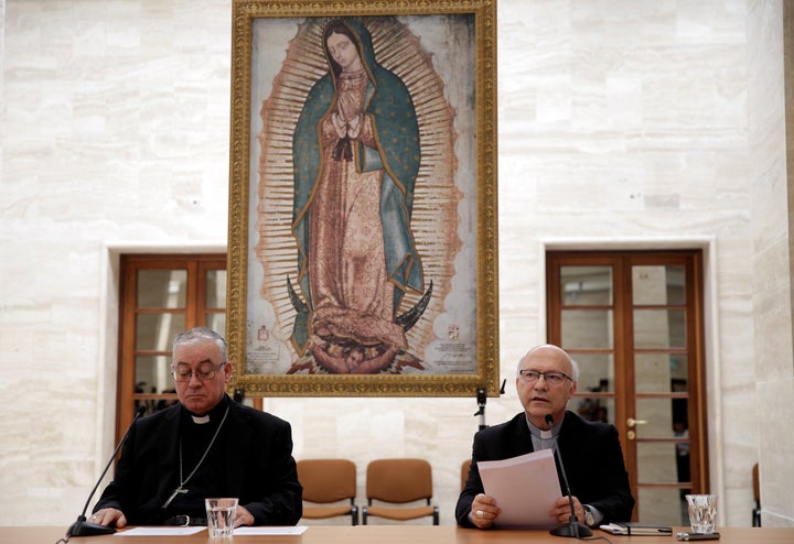 Chilean bishops Luis Fernando Ramos Perez and Juan Ignacio Gonzalez Errazuriz read statements during a news conference after meeting with Pope Francis at the Vatican on May 18.