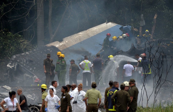 Emergency personnel work at the site of a plane crash outside Havana’s Jose Marti International Airport on Friday.