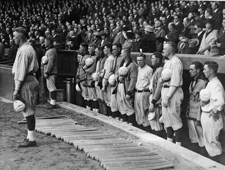 The New York Yankees hold their caps over their hearts during the national anthem in 1921.
