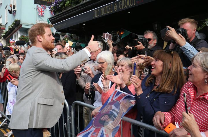 Prince Harry meet members of the public outside Windsor Castle ahead of his wedding to Meghan Markle this weekend.