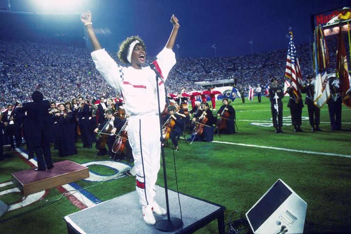 Whitney Houston sings the national anthem during the pregame show at Super Bowl XXV in 1991.
