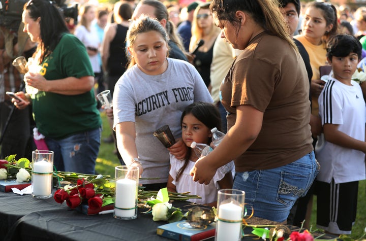 Community members honor the victims of Friday's mass shooting at Santa Fe High School in Texas.