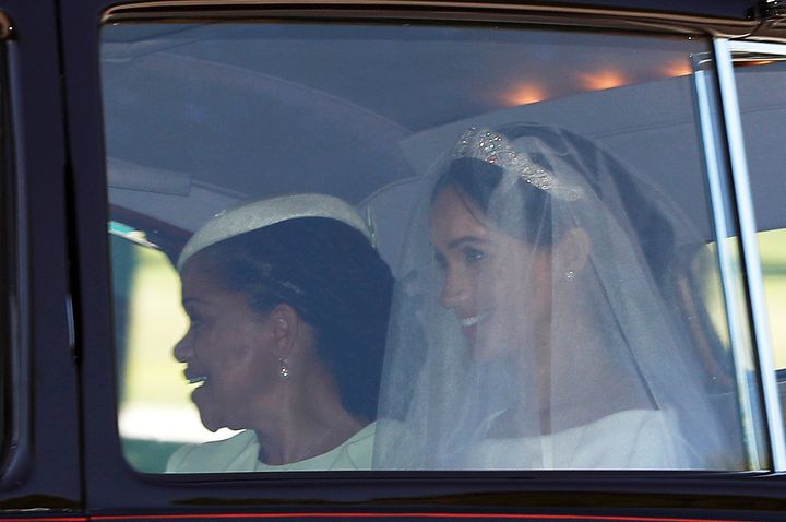 The bride was seated next to her mother, Doria Ragland 