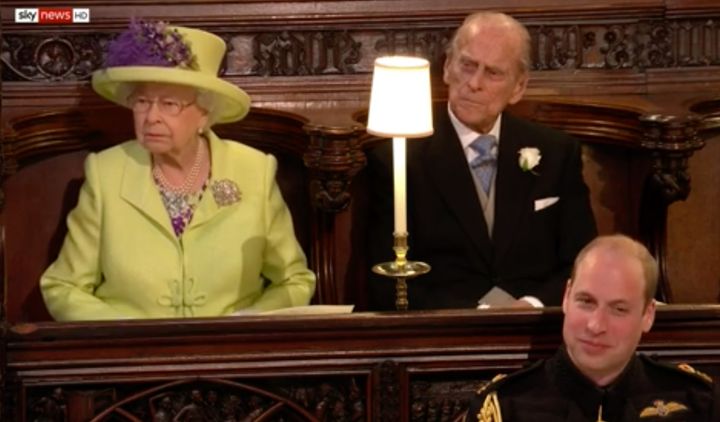 The Queen does not look amused - unlike her grandson and best man on the day, Prince William.