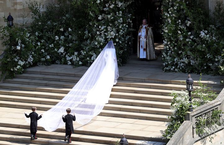 Markle’s five-metre-long silk tulle veil features a trim of hand-embroidered silk and organza flowers, to represent the 53 countries of the Commonwealth. 