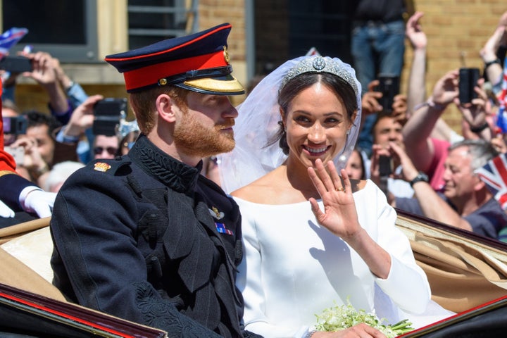 Prince Harry and Meghan Markle, the new Duke and Duchess of Sussex, pictured during their carriage procession through Windsor after the royal wedding on Saturday.