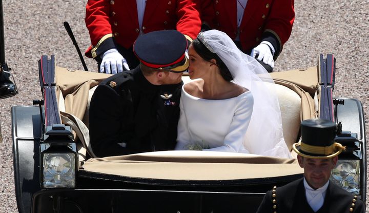 Prince Harry and Meghan Markle ride in an Ascot Landau along the Long Walk after their wedding in St George's Chapel at Windsor Castle.