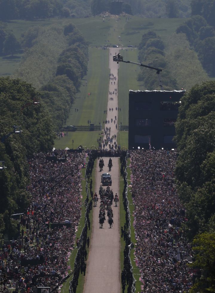 Meghan Markle and Prince Harry ride in an Ascot Landau carriage up the Long Walk at Windsor Castle after their wedding.