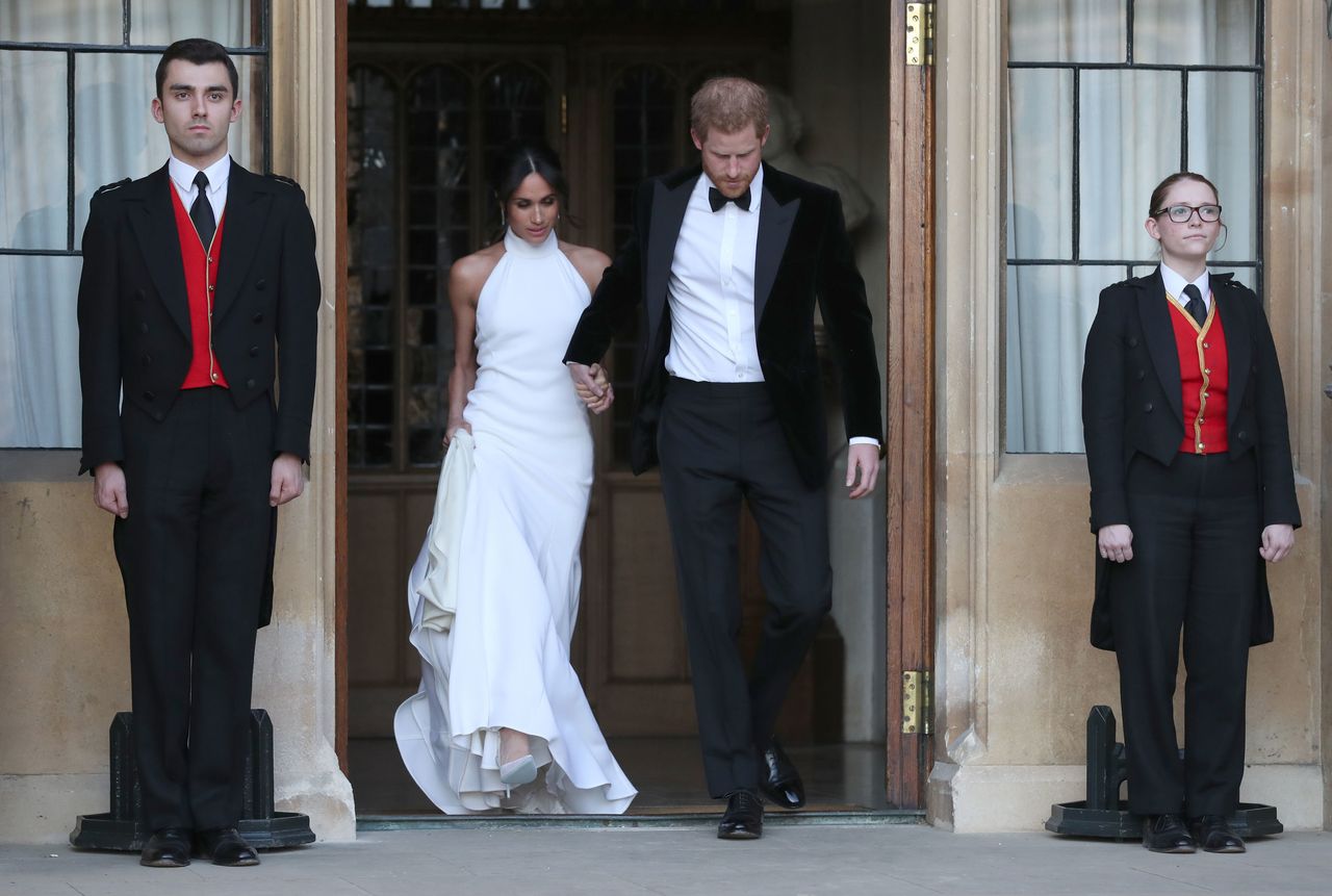 The newly married Duke and Duchess of Sussex, Meghan Markle and Prince Harry, leaving Windsor Castle after their wedding to attend an evening reception