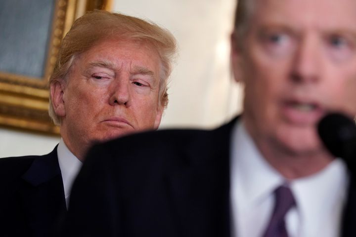 Trump listens to remarks by U.S. Trade Representative Robert Lighthizer at the White House on March 22.