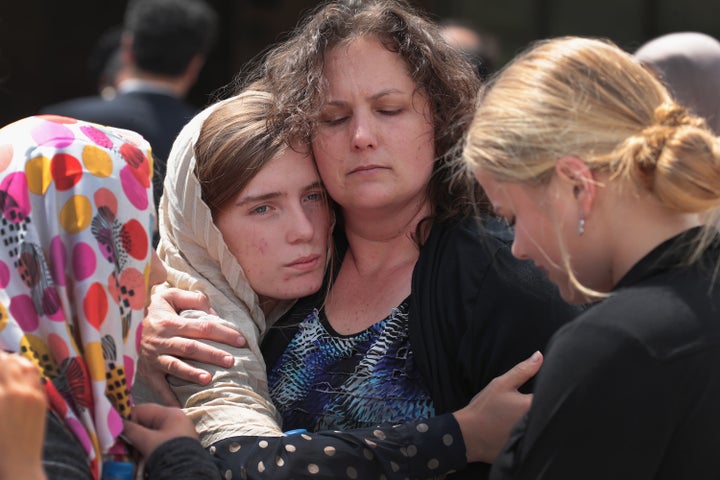 Sabika Sheikh's host family members are comforted following a funeral prayer service at the Brand Lane Islamic Center on May 