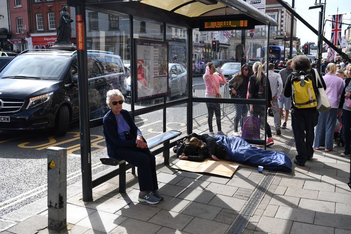 A rough sleepers shelters in a bus stop in Windsor a day before Prince Harry married Meghan Markle
