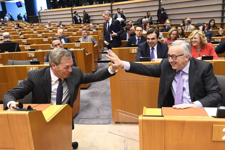 European Commission President Jean-Claude Juncker high fives Nigel Farage in the European Parliament earlier this month.