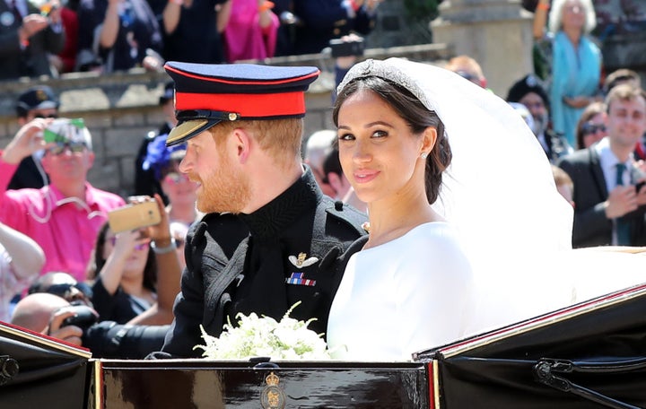 Prince Harry, Duke of Sussex and the Duchess of Sussex in the Ascot Landau carriage during the procession after getting married at St George's Chapel, Windsor Castle on May 19, 2018 in Windsor, England.