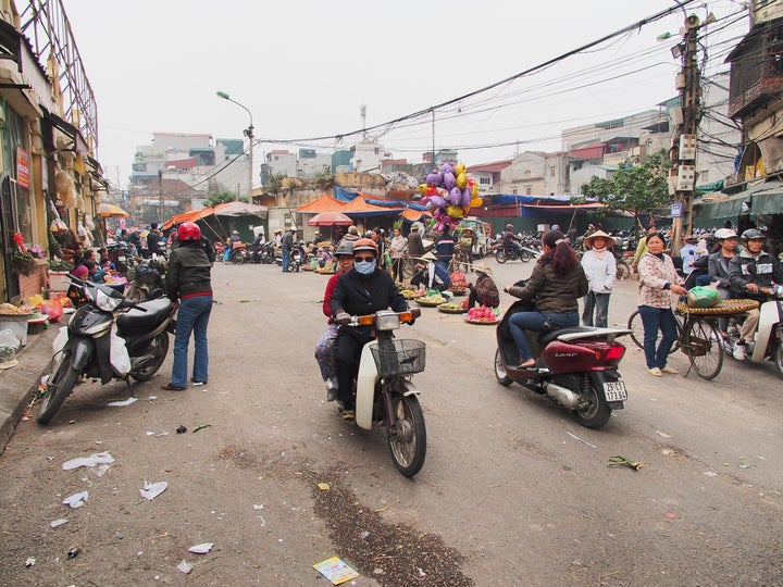 A motorcyclist wears a mask to block the smog in Hanoi. 