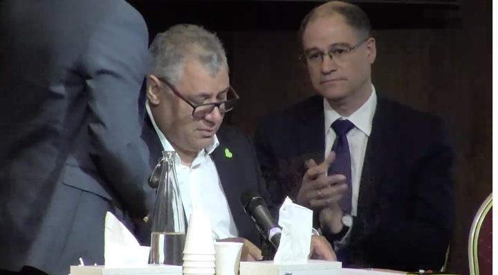 <strong>Nicholas Burton is comforted while delivering a heartfelt tribute to his late wife, Maria del Pilar Burton, during the public hearing into the Grenfell Tower fire</strong>