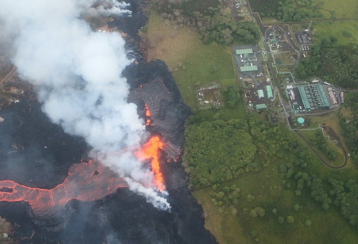 Lava erupts and flows from a Kilauea volcano fissure, near the Puna Geothermal Venture plant, on May 21.