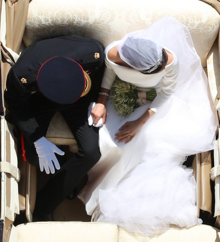 Prince Harry and Meghan Markle ride in an Ascot Landau along the Long Walk after their wedding in St George's Chapel in Windsor Castle.