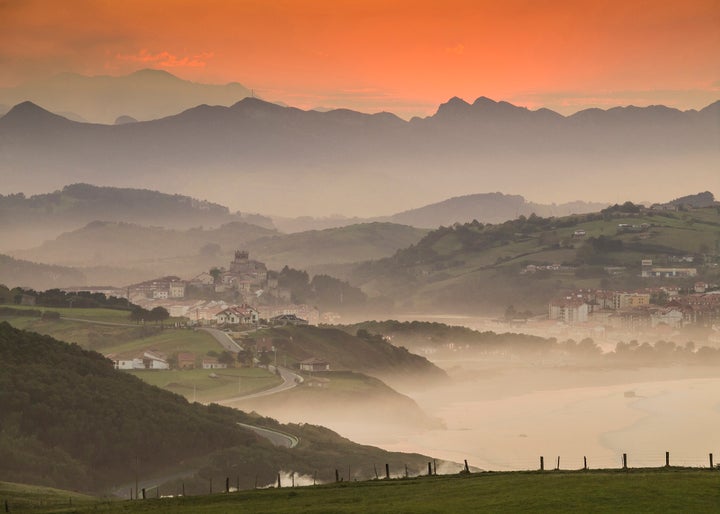 Mist rises as the sun sets on San Vicente de la Barquera, one of Cantabria's many picturesque towns. Cantabria's is Lonely Planet's No. 2 underrated European destination for 2018. 