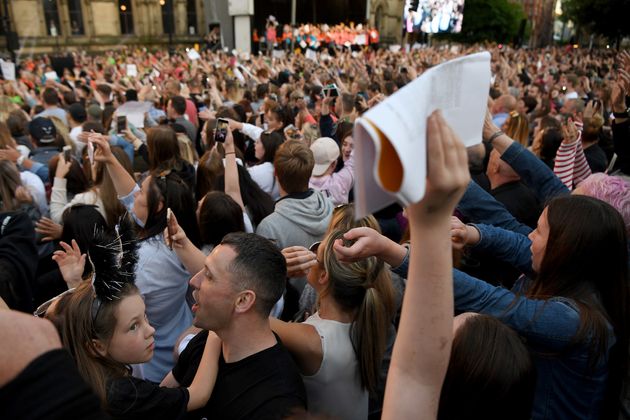 The audience sings along to Don't Look Back In Anger during the 'Manchester Together - With One Voice' concert at St Anne's Square.