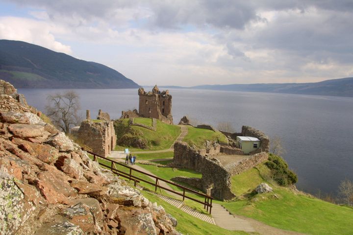  The ruined Urquhart Castle towering over the western shore of Loch Ness at Drumnadrochit. The loch is famed for the mythical monster Nessie which has been spotted by people from all over the world. 