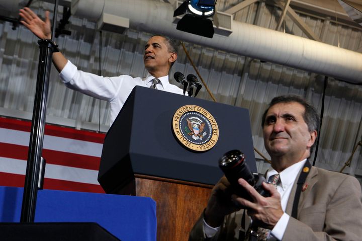 Former White House photographer Pete Souza, seen standing in front of President Barack Obama in 2012, is releasing a new photo book.