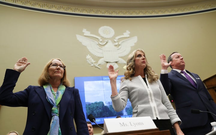 From left, USOC acting chief Susanne Lyons, USA Gymnastics CEO Kerry Perry and USA Swimming president and CEO Tim Hinchey prepare to testify on Capitol Hill, May 23, 2018.