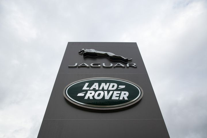 A logo sits outside the Jaguar Land Rover vehicle manufacturing plant in Solihull, West Mids.