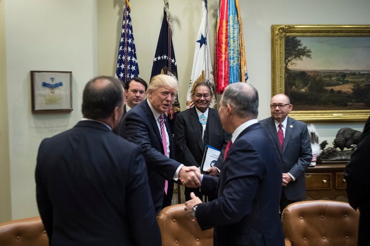 Trump shakes Pruitt's hand on June 28, 2017.