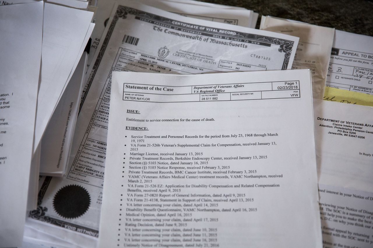 Stacks of paperwork that Kate Naylor has collected in pursuit of receiving compensation from the Department of Veteran Affairs.