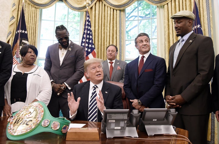 Donald Trump speaks after granting posthumous pardon to former heavyweight champion Jack Johnson in the Oval Office on May 24. Attending the event are (left to right) Linda Haywood, Great great niece of Jack Johnson, Deontay Wilder, Keith Frankel, Sylvester Stallone, and Lennox Lewis.