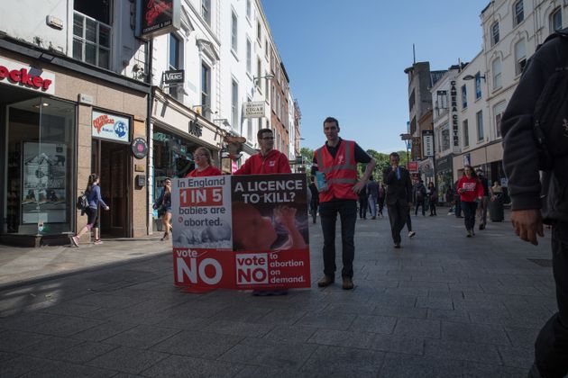 Young anti-abortion campaigners stand on Grafton Street, in Dublin city. 