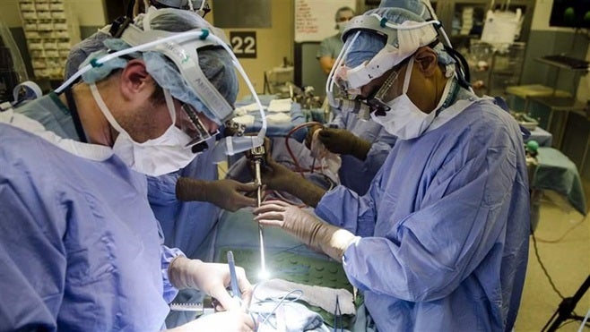 Doctors perform surgery at the Hospital of the University of Pennsylvania in Philadelphia. States are concerned about their ability to regulate association health plans under a new rule the Trump administration is close to finalizing.