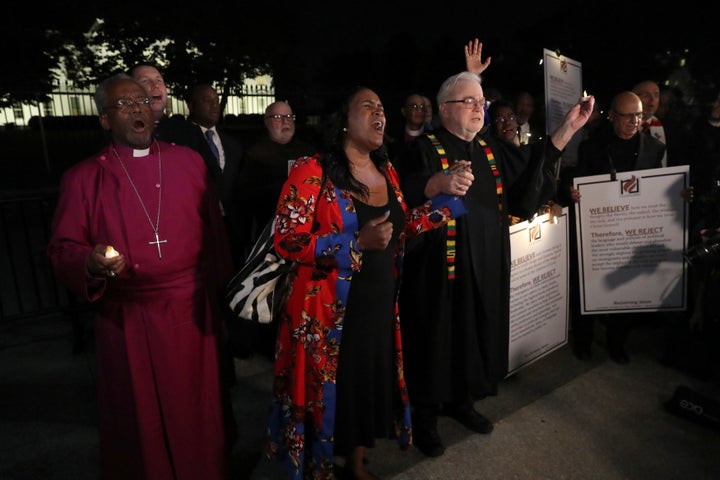 Episcopal Church Presiding Bishop Michael Curry (L) and Sojourners President and Founder Rev. Jim Wallis (R) lead fellow clergy in a vigil.