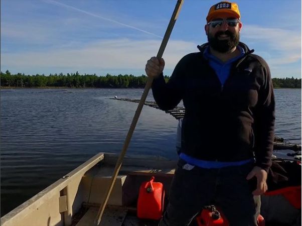 Maxime Daigle often takes to the cold waters off New Brunswick in one of his family's flat-bottomed boats to harvest oysters.