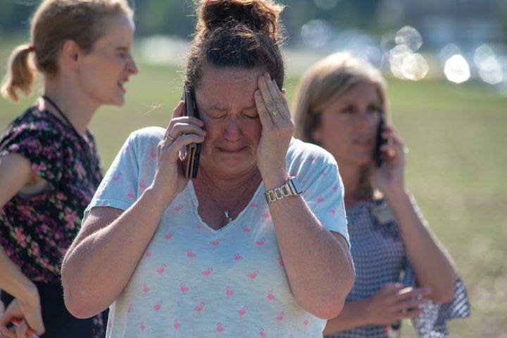 Instructional Assistant Paige Rose reacts outside Noblesville West Middle School after the shooting.