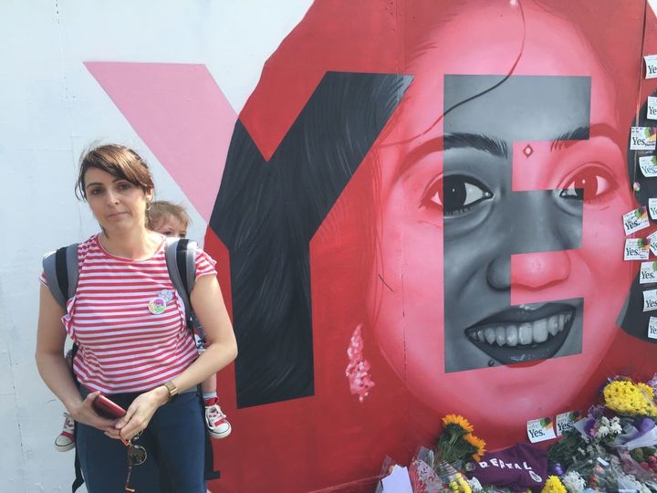 Jill Jordan and baby Ivy pay their tributes at the mural