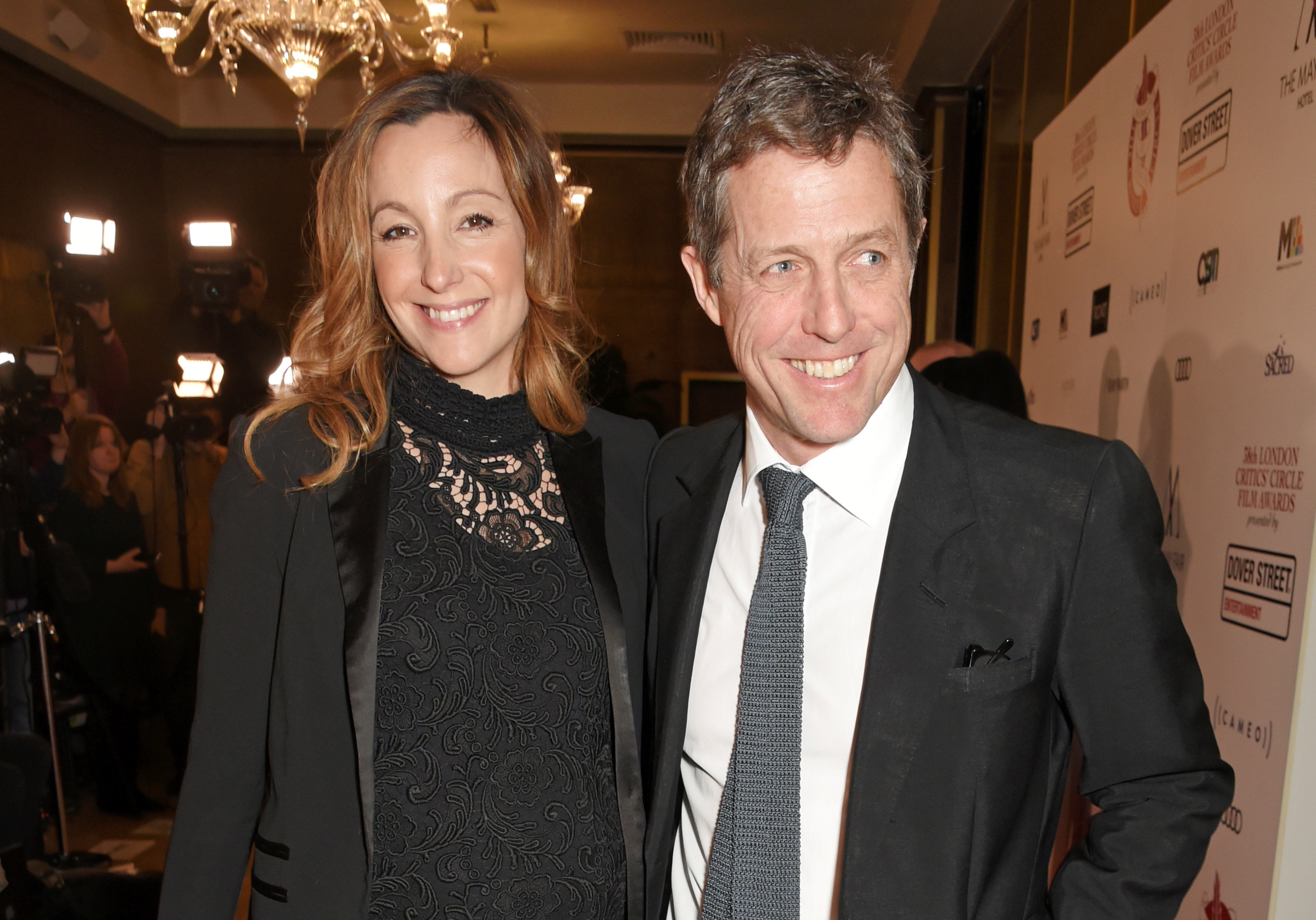 David M. Benett via Getty Images Hugh Grant and Anna Eberstein