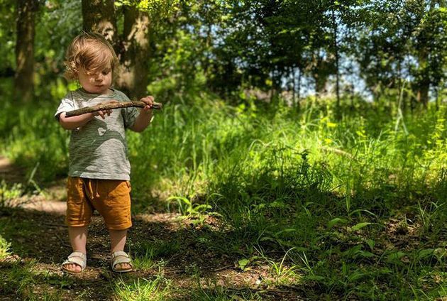 Dad Stephen Skinner's son Atlas enjoying the outside discovering woodland treasures.